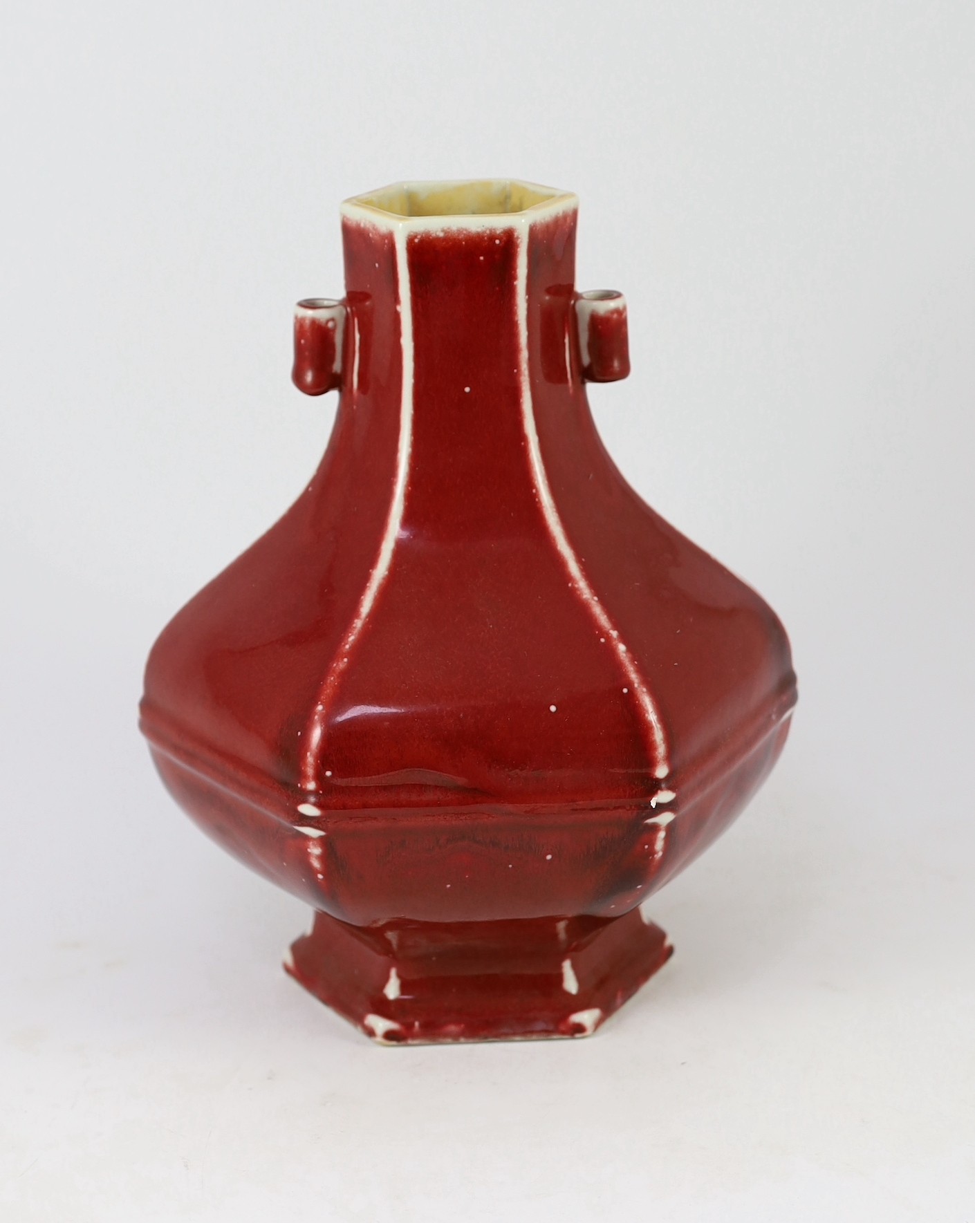 A Chinese copper red glazed hexagonal hu vase, late 19th/early 20th century, 28cm high